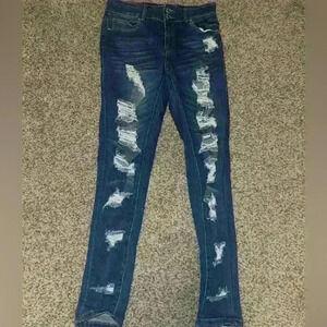Distressed denim skinny jeans